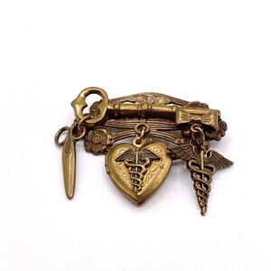 Vntg Pin Filigree Charms Of Health Caduceus Symbol Scissors and Heart Locket